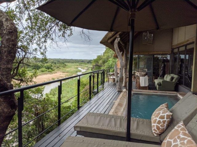 outdoor deck looking over river bed in Sabi Sands