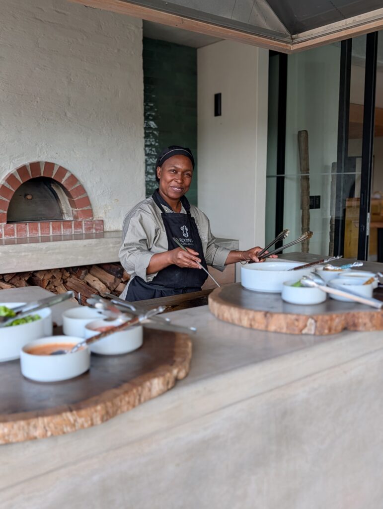 Lady serving lunch at RockFig Safari Lodge