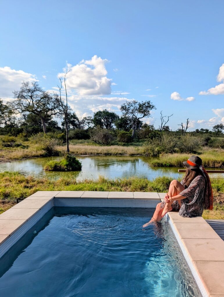 Guest relaxing beside a private plunge pool at RockFig Safari Lodge